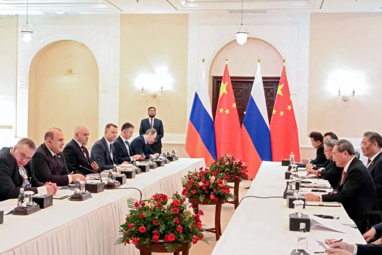 Members of the delegations, led by Russian Prime Minister Mikhail Mishustin and Chinese Premier Li Qiang, attend a meeting on the sidelines of the government heads' council at the Shanghai Cooperation Organization (SCO) summit in Islamabad, Pakistan October 16, 2024. Sputnik/Roman Naumov/Pool via REUTERS ATTENTION EDITORS - THIS IMAGE WAS PROVIDED BY A THIRD PARTY.