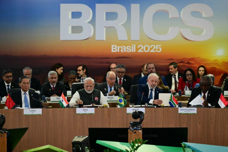 Heads of state and government of member, partner, and external engagement countries attend a plenary session of the BRICS summit in Rio de Janeiro, Brazil, on July 7, 2025. BRICS leaders at a summit on Sunday took aim at US President Donald Trump's "indiscriminate" import tariffs and recent Israeli-US strikes on Iran. (Photo by Pablo PORCIUNCULA / AFP)