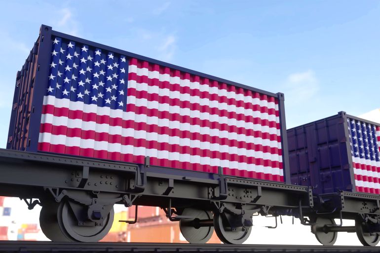 Train and containers with the flag of USA. Railway transportation. 3d illustration. GettyImages-1417726017