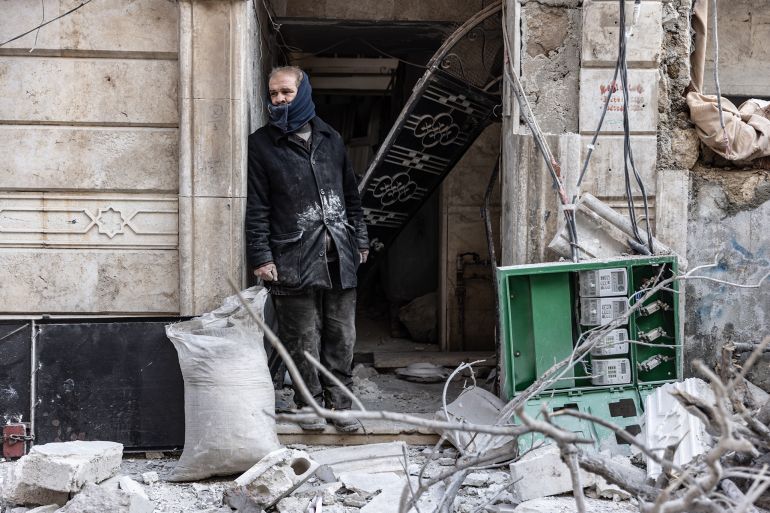 02 December 2024, Syria, Idlib: A man stands in front of his house, damaged by a Syrian regime airstrike on the city of Idlib. At least 11 people, including five children, lost their lives as Syrian and Russian warplanes targeted rebel-held areas in northwestern Syria on Monday, according to activists and a monitoring group. Photo: Anas Alkharboutli/dpa (Photo by Anas Alkharboutli/picture alliance via Getty Images)