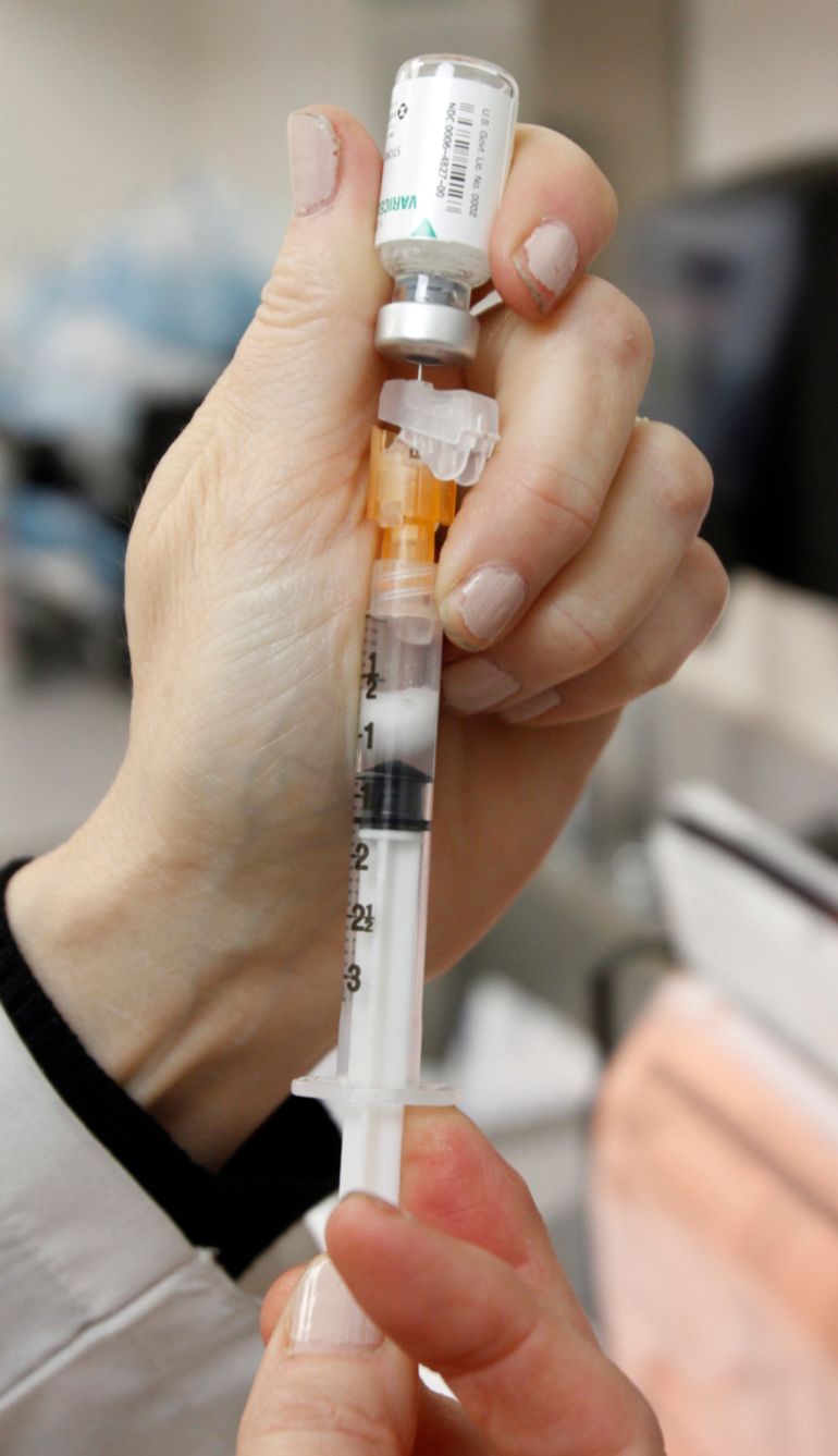 In this April 20, 2012, photo, Nurse Catherine Craige draws a chickenpox vaccination in Berlin, Vt. Vermont continues to be embroiled in a debate over ending the philosophical exemption that allows parents to have their kids skip the immunizations required for most children to attend school. (AP Photo/Toby Talbot)
