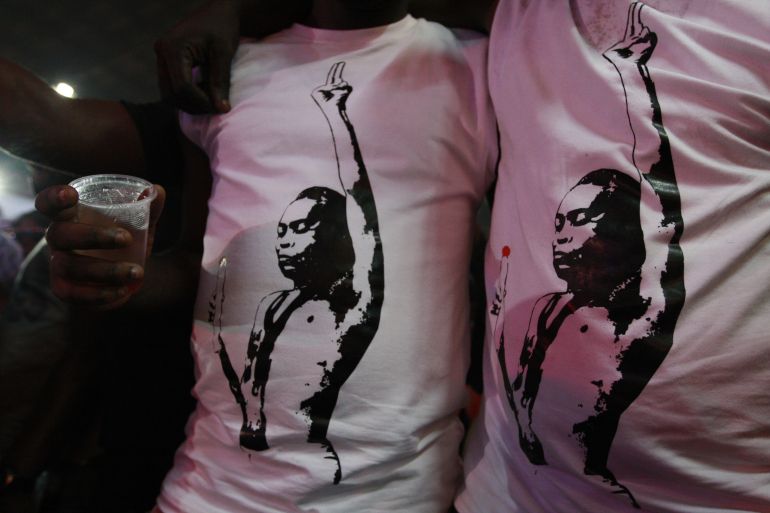 Two men wear T-shirts showing Fela Anikulapo-Kuti with a giant joint at the New Afrika Shrine in Lagos, Nigeria, on Sunday, Oct. 21, 2012. Sunday was the final set of performances for the annual Felabration festival, a series of concerts put on by the family of the late Afrobeat singer Fela Anikulapo-Kuti. (AP Photo/Jon Gambrell)