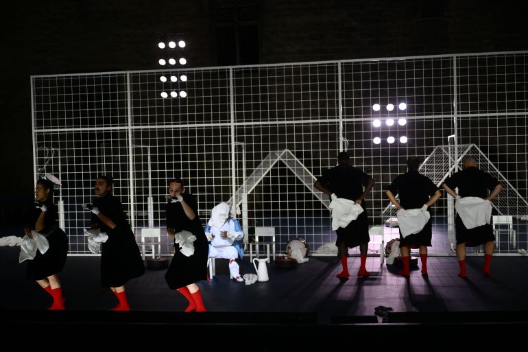 Actors perform in "Not" directed by Cape Verdean choreographer and dancer Marlene Monteiro Freitas during a rehearsal for the opening night of the Avignon Theatre festival, at the Palais des Papes in Avignon on July 3, 2025. Freitas, who will open the 79th Festival d'Avignon with a show inspired by the tales of the "Thousand and One Nights", is an outsider with a protean and colourful universe. (Photo by Christophe SIMON / AFP) / The erroneous mention[s] appearing in the metadata of this photo by Christophe SIMON has been modified in AFP systems in the following manner: [rehearsal] instead of [premiere]. Please immediately remove the erroneous mention[s] from all your online services and delete it (them) from your servers. If you have been authorized by AFP to distribute it (them) to third parties, please ensure that the same actions are carried out by them. Failure to promptly comply with these instructions will entail liability on your part for any continued or post notification usage. Therefore we thank you very much for all your attention and prompt action. We are sorry for the inconvenience this notification may cause and remain at your disposal for any further information you may require.