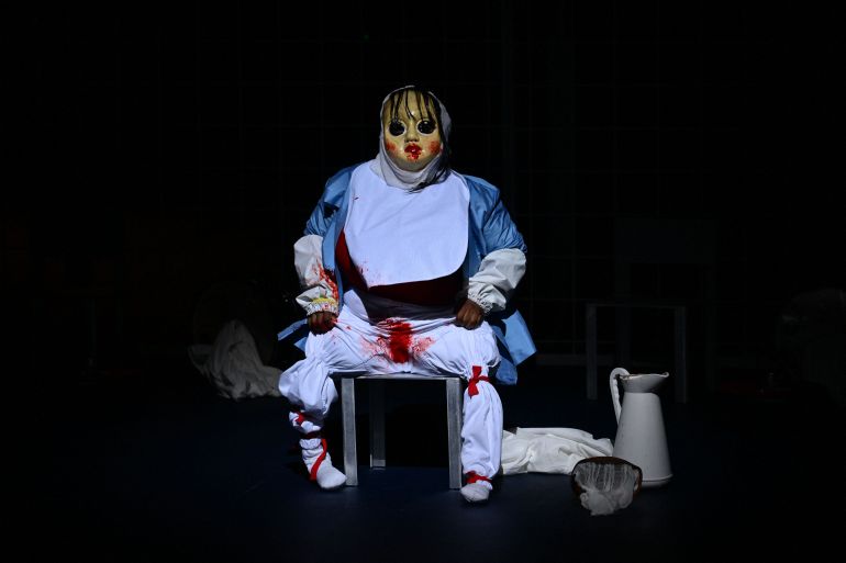 An actor performs in "Not" directed by Cape Verdean choreographer and dancer Marlene Monteiro Freitas during a rehearsal for the opening night of the Avignon Theatre festival, at the Palais des Papes in Avignon on July 3, 2025. Freitas, who will open the 79th Festival d'Avignon with a show inspired by the tales of the "Thousand and One Nights", is an outsider with a protean and colourful universe. (Photo by Christophe SIMON / AFP) / The erroneous mention[s] appearing in the metadata of this photo by Christophe SIMON has been modified in AFP systems in the following manner: [rehearsal] instead of [premiere]. Please immediately remove the erroneous mention[s] from all your online services and delete it (them) from your servers. If you have been authorized by AFP to distribute it (them) to third parties, please ensure that the same actions are carried out by them. Failure to promptly comply with these instructions will entail liability on your part for any continued or post notification usage. Therefore we thank you very much for all your attention and prompt action. We are sorry for the inconvenience this notification may cause and remain at your disposal for any further information you may require.