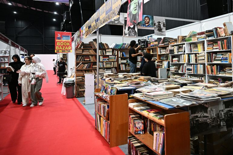 People visit the 66th Beirut Arab International Bookfair in the Lebanese capital on May 15, 2025. (Photo by Joseph EID / AFP)