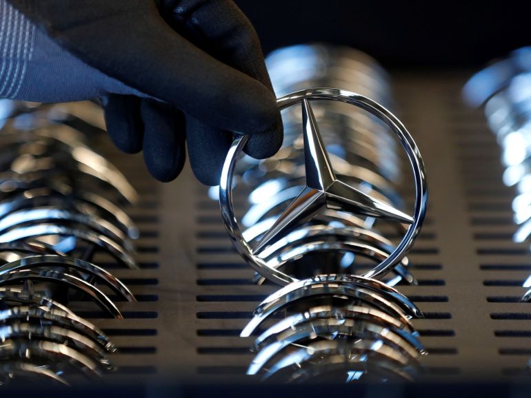 An employee of German car manufacturer Mercedes Benz prepares the company's logo prior to its installation at the A-class production line at the Daimler factory in Rastatt, Germany, February 4, 2019. REUTERS/Kai Pfaffenbach