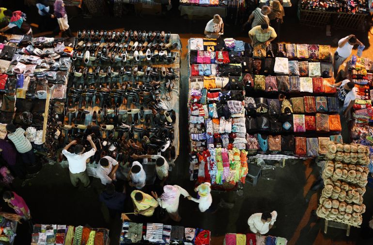 CAIRO, EGYPT - MAY 28: Shoppers move among tables containing clothes and shoes at Ataba market on May 28, 2011 in Cairo, Egypt. Protests in January and February brought an end to 30 years of autocratic rule by President Hosni Mubarak who will now face trial. Food prices have doubled and youth unemployment stands at 30%. Tourism is yet to return to pre-uprising levels. (Photo by Peter Macdiarmid/Getty Images)