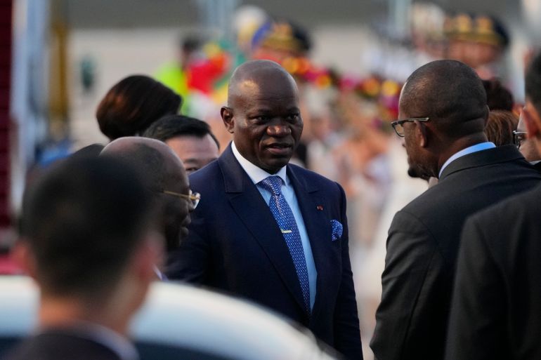 BEIJING, CHINA - SEPTEMBER 01: Gabon's President, Brice Clotaire Oligui Nguema (C) talks as he arrives at Beijing Capital International Airport ahead of the 2024 Summit of the Forum on China-Africa Cooperation (FOCAC) on September 1, 2024 in Beijing, China. The forum between the People's Republic of China and most states in Africa is scheduled to be held from September 4th through the 6th. (Photo by Ken Ishii - Pool/Getty Images)