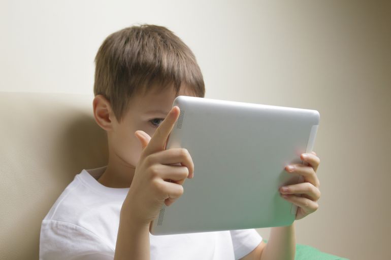 Child using digital tablet PC at home. Education, learning, leisure concept; Shutterstock ID 548461606; purchase_order: aj; job: ; client: ; other: