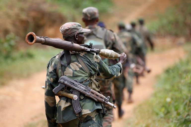 Democratic Republic of the Congo military personnel patrol against Allied Democratic Forces (ADF) and National Army for the Liberation of Uganda (NALU) rebels near Beni in North Kivu province, in 2013 [File: Kenny Katombe/Reuters]