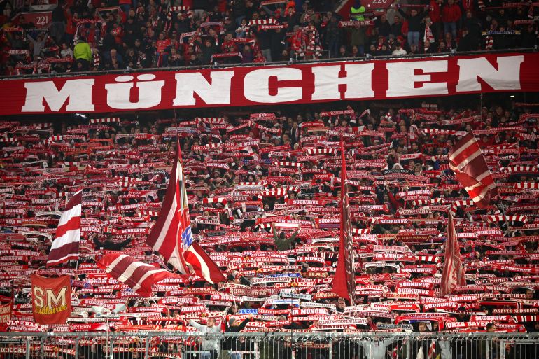 MUNICH, GERMANY - NOVEMBER 06: Fans of Bayern Munich hold scarves and fly flags in support prior to the UEFA Champions League 2024/25 League Phase MD4 match between FC Bayern München and SL Benfica at Football Arena Munich on November 06, 2024 in Munich, Germany. (Photo by Adam Pretty/Getty Images)