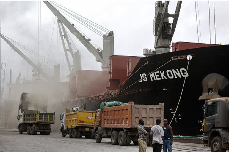 Cranes are seen unloading 'Clinker' from the JS Mekong, a bulk carrier ship and into waiting trucks while on the dockside at Mombasa port, managed by the Kenya Ports Authority, a state-run company in Mombasa, Kenya, on Friday, April 26, 2013. Kenya's Mombasa port is East Africa's busiest, handling imports that include grain, fertilizer, cement and oil as well as exports of coffee, tea and sugar. Photographer: Trevor Snapp/Bloomberg via Getty Images
