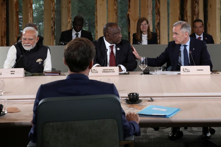 Canada's Prime Minister Mark Carney talks to South Africa's President Cyril Ramaphosa as they attend a meeting during the G7 Leaders' Summit in Kananaskis, in Alberta, Canada, June 17, 2025. REUTERS/Amber Bracken