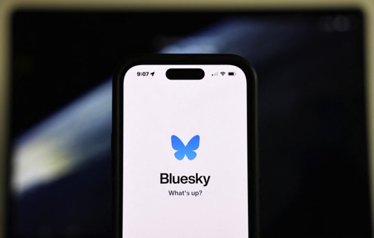 PASADENA, CALIFORNIA - NOVEMBER 14: In this photo illustration, the Bluesky logo is displayed on a cell phone on November 14, 2024 in Pasadena, California. The social media app Bluesky has seen its user base increase by 1.25 million since the U.S. Presidential elections as some people leave rival X, which is owned by Elon Musk. (Photo Illustration by Mario Tama/Getty Images) (Photo by MARIO TAMA / GETTY IMAGES NORTH AMERICA / Getty Images via AFP)