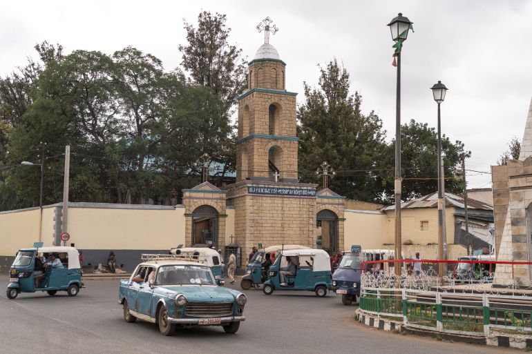 The main gate into Harar Jugol, the old walled city, with a portrait of Abd Allah ash-Shakur, the last Emir of Harar who led the defence of the city against the forces of Menelik II [Jaclynn Ashly/Al Jazeera]