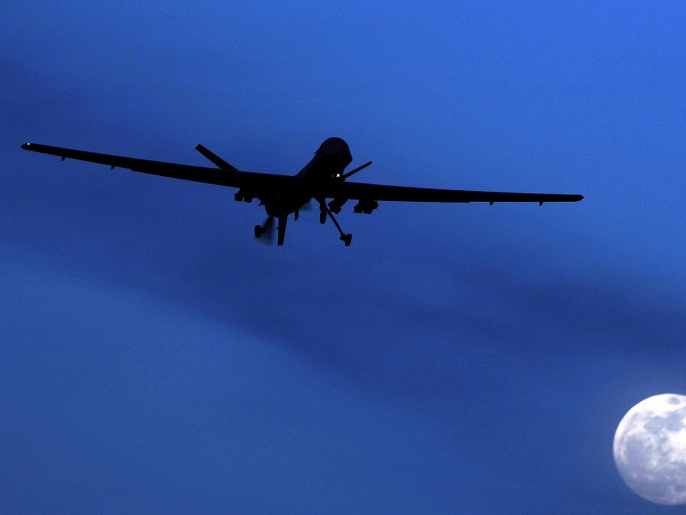 FILE - In this Jan. 31, 2010, file photo, an unmanned U.S. Predator drone flies over Kandahar Air Field, southern Afghanistan on a moonlit night. The Obama administration is amending its regulations for weapons sales to allow the export of armed military drones to friendly nations and allies. The State Department said Tuesday, Feb. 17, 2015, the new policy would allow foreign governments that meet certain requirements — and pledge not to use the unmanned aircraft illegally — to buy the vehicles that have played a critical but controversial role in combating terrorism and are increasingly used for other purposes. (AP Photo/Kirsty Wigglesworth, File)