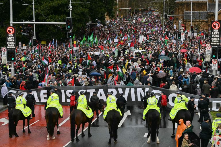 Mounted police keep watch as protesters in support of Palestinians in Gaza march towards Sydney's Harbour Bridge during a demonstration against the actions of Israel on August 3, 2025. (Photo by Saeed KHAN / AFP)