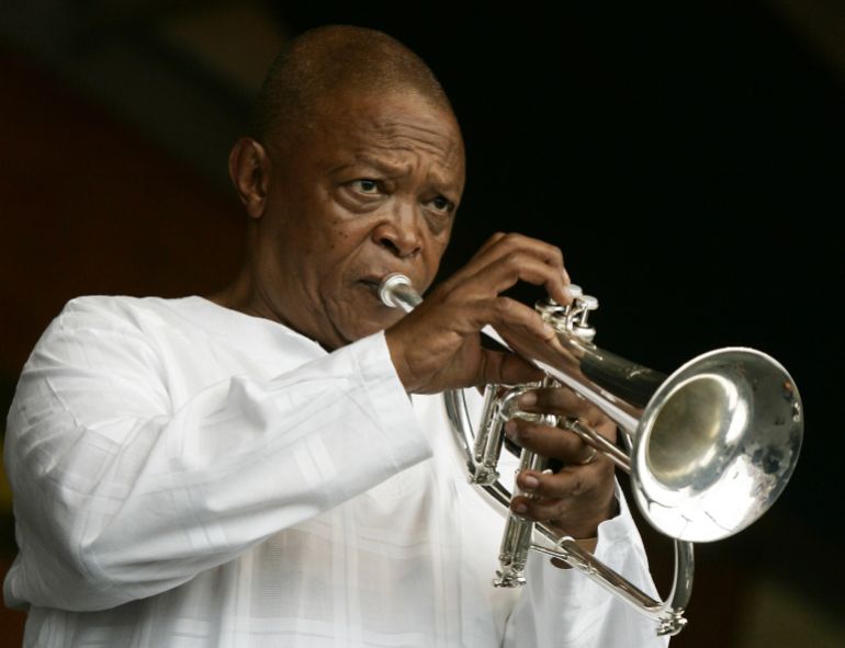 FILE - In an April 29, 2006 file photo, Hugh Masekela performs during the 2006 New Orleans Jazz and Heritage Festival in New Orleans. (AP Photo/Jeff Christensen, File)