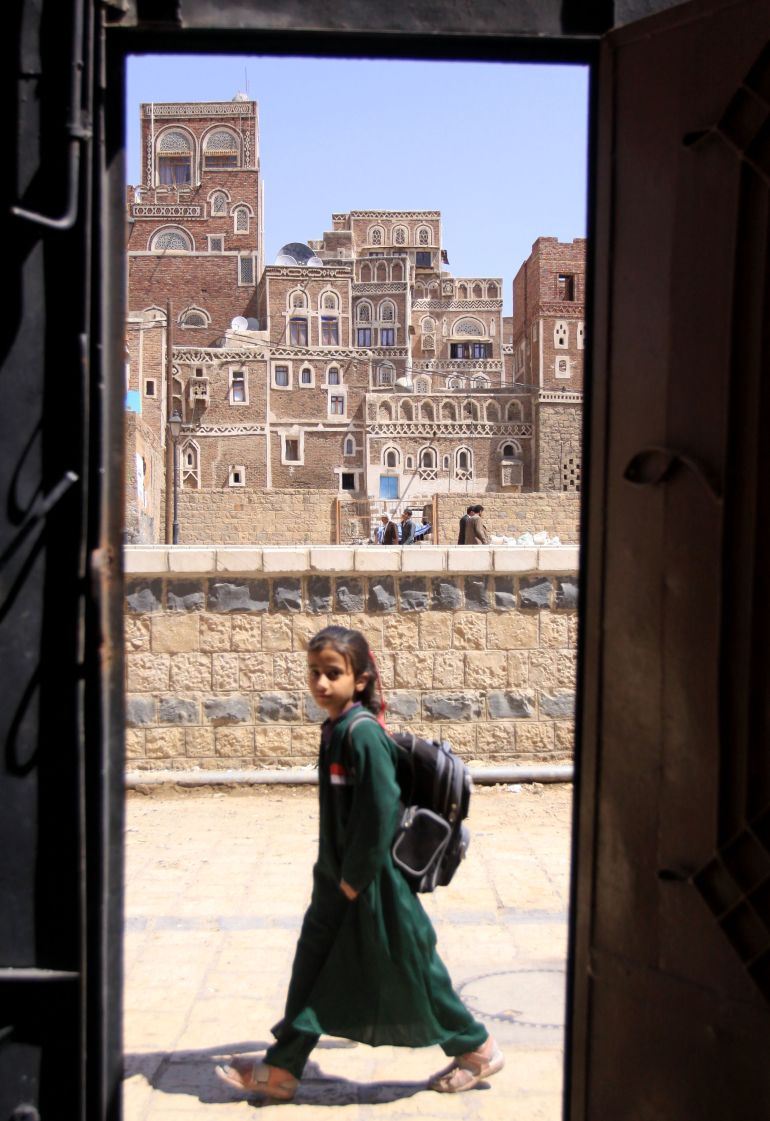 An unidentified Yemeni school girl is seen through the Saba Institute gate in the capital San'a, Yemen Sunday. Oct. 31, 2010. Al Qaida in Yemen, suspected in the thwarted mail bombing attempt, appears to be aggressively seeking to recruit American and European radicals who could provide an entry way for the group to carry out attacks in their homelands. (AP Photo/Hasan Jamali)