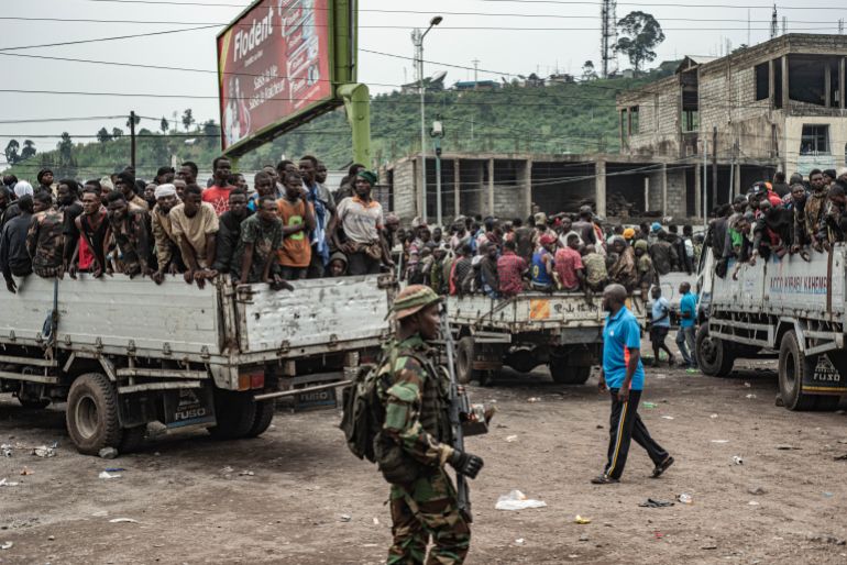 GOMA, DEMOCRATIC REPUBLIC OF CONGO - JANUARY 30: Men who are among the estimated 2400 Congolese (FARDC) soldiers who surrendered en masse to M23 rebels are loaded on to trucks to be taken to an unknown location from the Stade de l'Unite on January 30, 2025 in Goma, Democratic Republic of Congo. The Rwanda-backed M23 rebel group has seized control Goma, in Eastern Congo, and are reportedly advancing south. (Photo by Daniel Buuma/Getty Images)