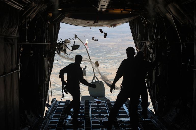 IN FLIGHT, GAZA - JULY 31: A Jordanian C-130 military aircraft performs an air drop of aid and supplies on July 31, 2025 over the Gaza Strip. The air drop was a joint effort with the United Arab Emirates Air Force and delivered twenty tons of food, baby milk, and other basic items. Jordan and other regional governments have recently resumed air drops of aid as the humanitarian crisis, including lack of access to food, has worsened. (Photo by Salah Malkawi/Getty Images)