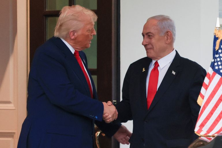 Israeli Prime Minister Benjamin Netanyahu and U.S. President Donald Trump shake hands following a meeting in the White House, in Washington, U.S., April 7, 2025. REUTERS/Kevin Mohatt