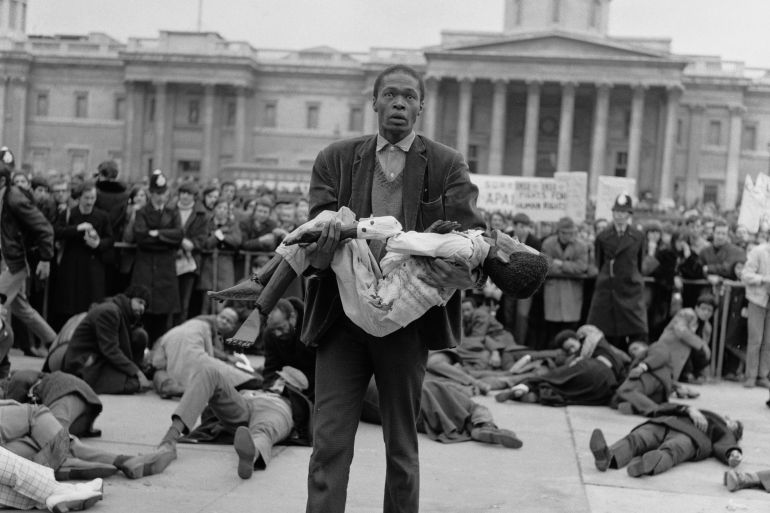 Members of the anti-apartheid movement commemorate the tenth anniversary of the Sharpeville massacre with a re-enactment outside South Africa House in Trafalgar Square, 21st March 1970. The Sharpeville incident resulted in 69 deaths as anti-apartheid demonstrators in South Africa were shot by government armed forces during a peaceful protest against the draconian 'Pass Laws' which restricted the movement of black people. (Photo by Roger Jackson/Central Press/Hulton Archive/Getty Images)