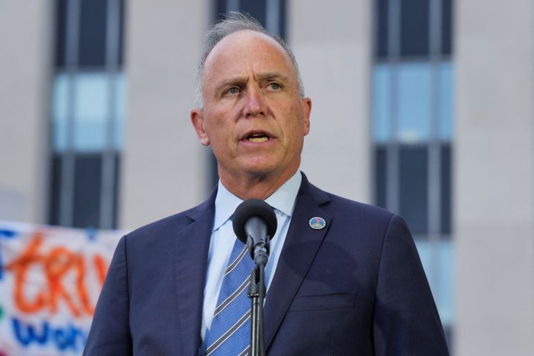 D.C. Attorney General Brian Schwalb speaks, as he gives a statement to the press, alongside D.C. Mayor Muriel Bowser (not pictured), following a conclusion of a court session, after U.S. President Donald Trump's announcement of the federal takeover of the Metropolitan Police Department under the Home Rule Act and the deployment of the National Guard to assist in crime prevention in the nation's capital, in Washington, D.C., U.S., August 15, 2025. REUTERS/Ken Cedeno